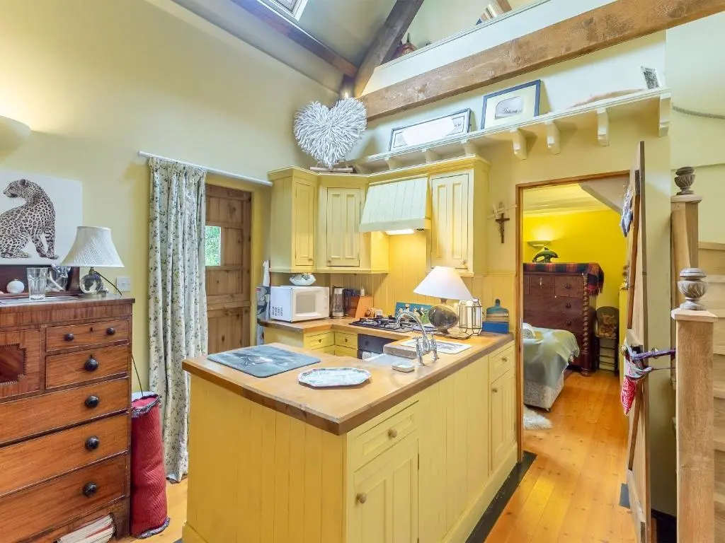 a kitchen with a large island in a room at Little Tarbet in Dornoch