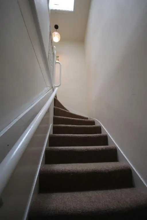 a staircase in a building with a light on it at Stag View in Garve