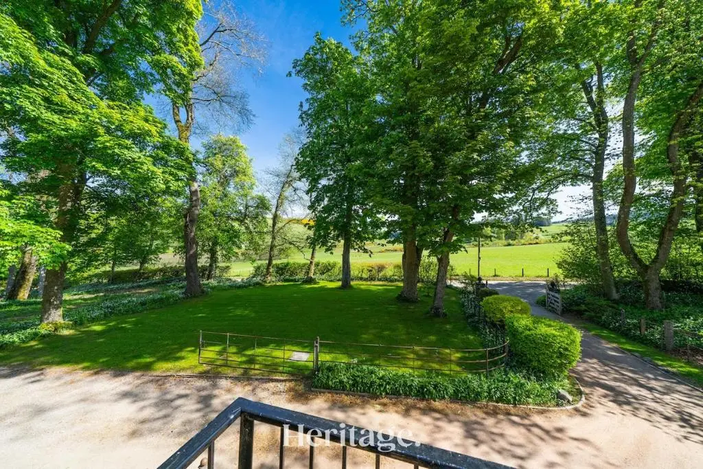 an aerial view of a park with trees at The Byre, Countryside Home in Tough