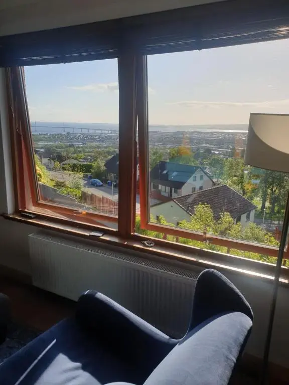 a room with a window with a couch and a view at 1 Bed Apartment Inverness with City Views in Inverness