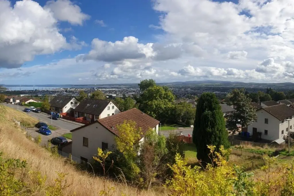 a small village with houses on a hill at 1 Bed Apartment Inverness with City Views in Inverness
