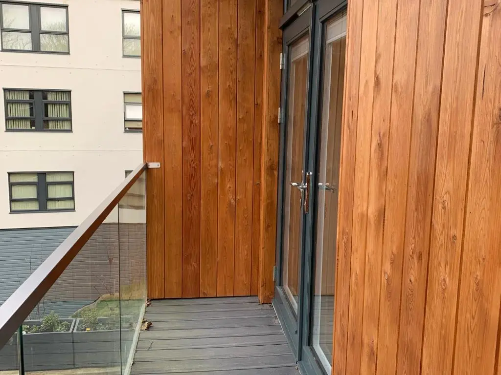 a wooden door on the side of a building at View Apartment in Inverness