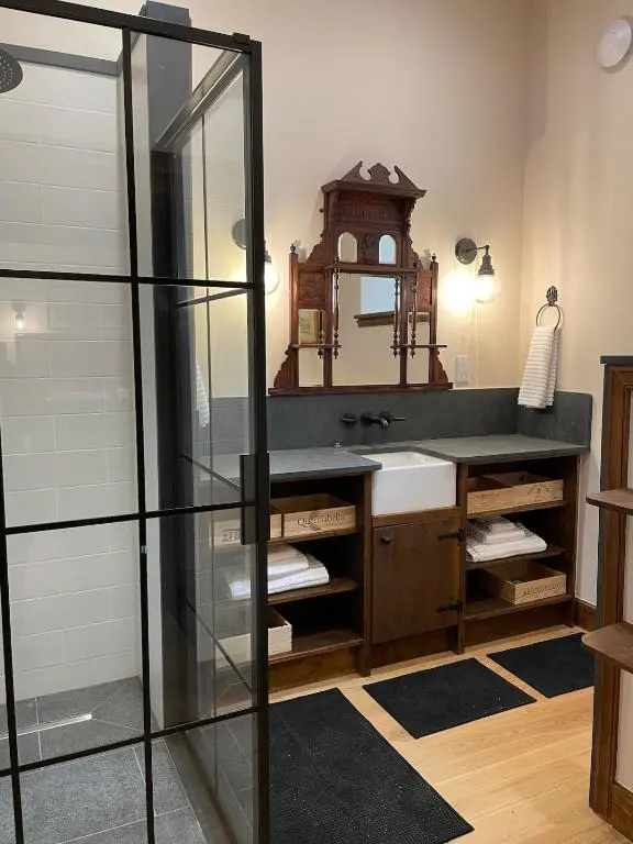 a bathroom with a sink and a mirror at Church Brae in Tomatin