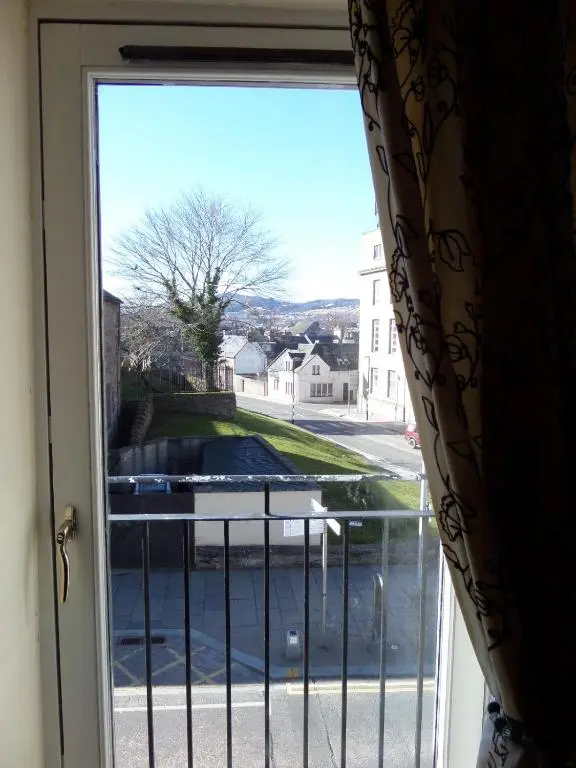 a window with a view of a street at Church Street Apartments in Inverness