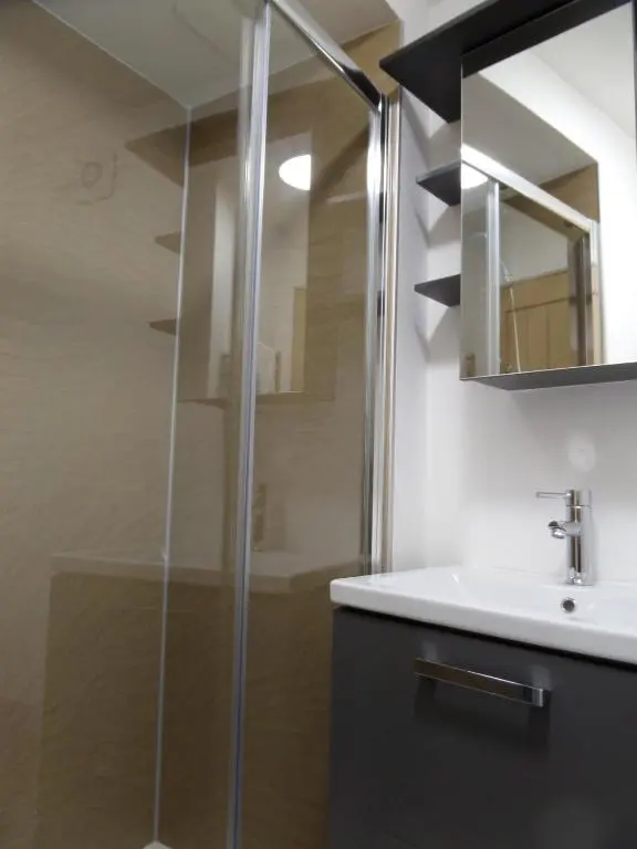 a bathroom with a shower and a sink at Church Street Apartments in Inverness