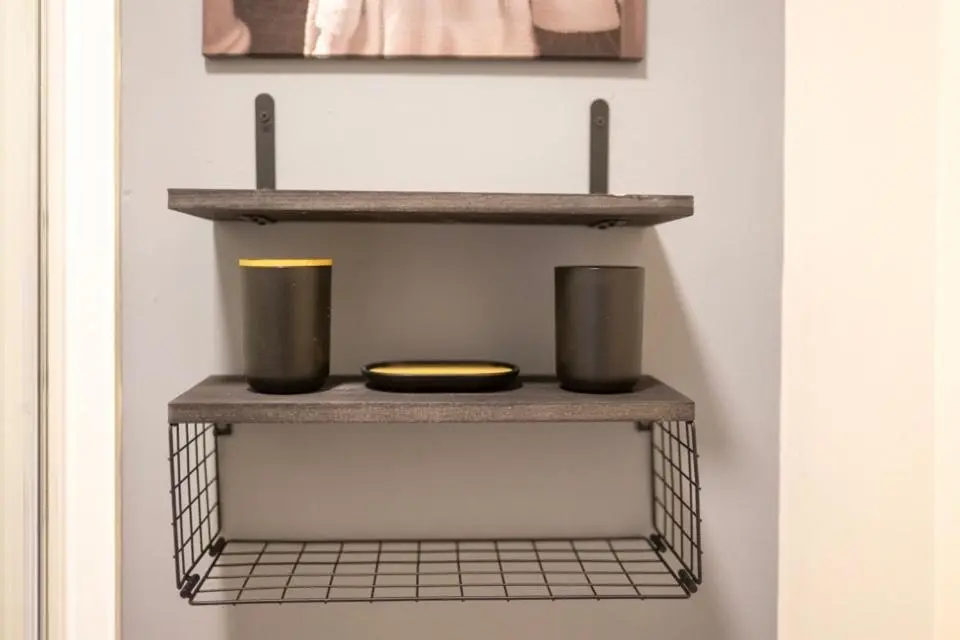 a shelf with two vases and a plate on it at 1 BDR Apt By Caledonia Luxe Stays Short Lets & Serviced Accommodation Inverness in Inverness