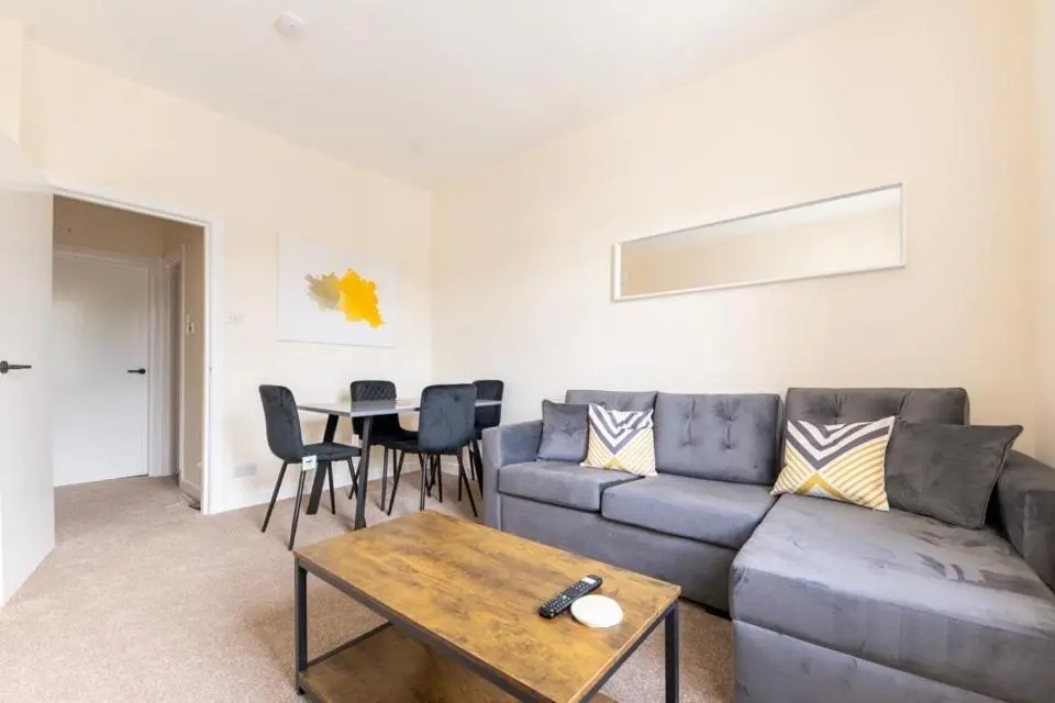 a living room with a couch and a table at 1 BDR Apt By Caledonia Luxe Stays Short Lets & Serviced Accommodation Inverness in Inverness