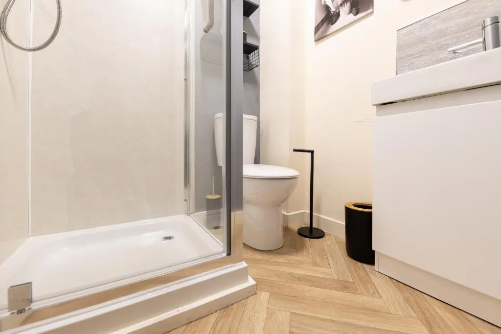 a bathroom with a shower and a toilet at 1 BDR Flat At Caledonia Luxe Stays Short Lets & Serviced Accommodation Inverness in Inverness