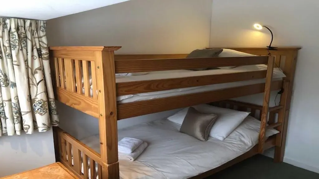 a couple of bunk beds in a room at Coach House in Drumnadrochit