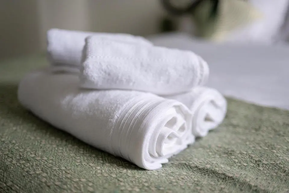 a group of white towels sitting on a counter at 1 BDR Apartment At Caledonia Luxe Stays Short Lets & Serviced Accommodation Inverness in Inverness