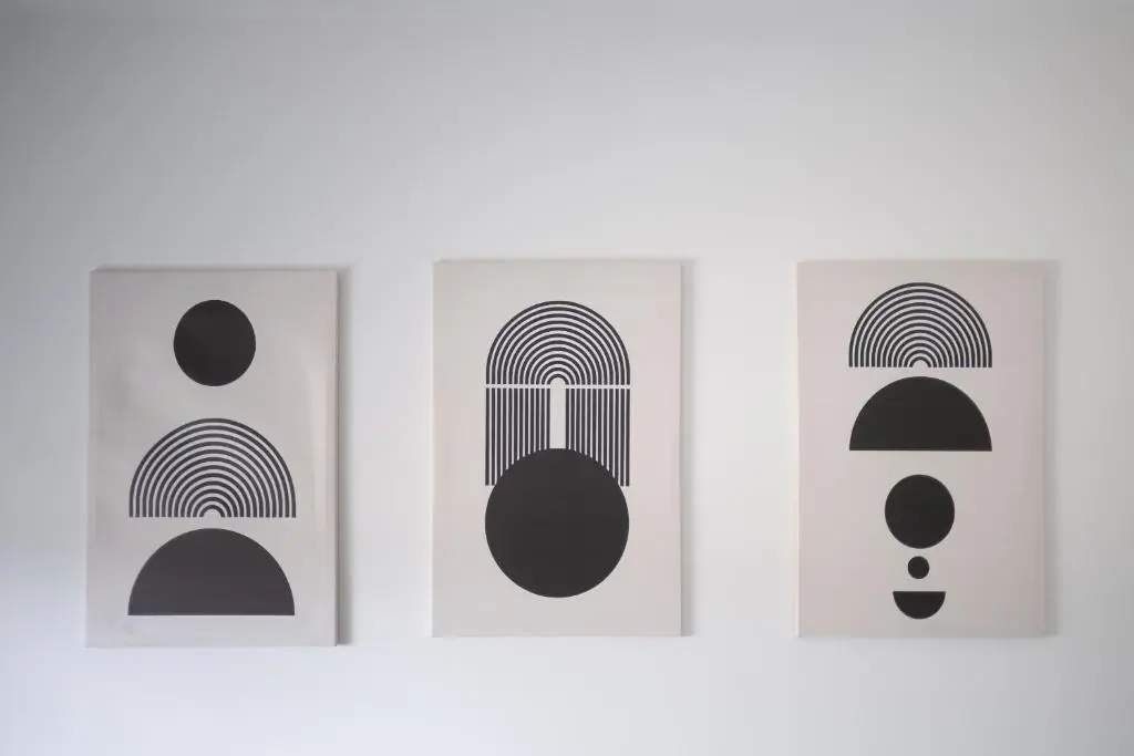 four black and white art prints on a white wall at Dram Apartment in Inverness