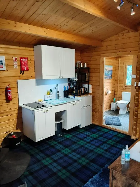 a kitchen with a sink and a toilet in a room at Emili Fois in Tore