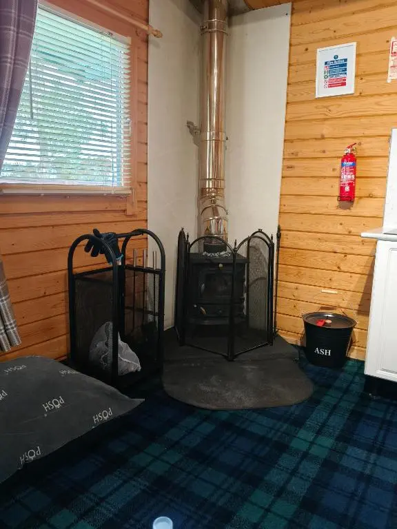 a room with a stove in the corner of a room at Emili Fois in Tore
