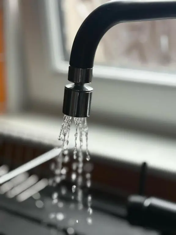 a close up of water dripping from a sink at Cloverdale Aparthotel in Aberdeen