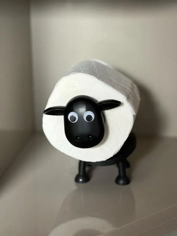 a stuffed animalanimal with a face on a shelf at Cloverdale Aparthotel in Aberdeen