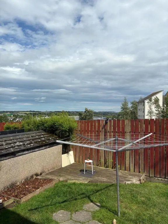 a small white chair sitting on top of a roof at Cloverdale Aparthotel in Aberdeen