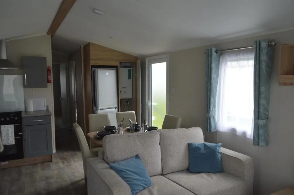 a living room with a couch and a table at B9 at The Old Mill Holiday Park in Dyke