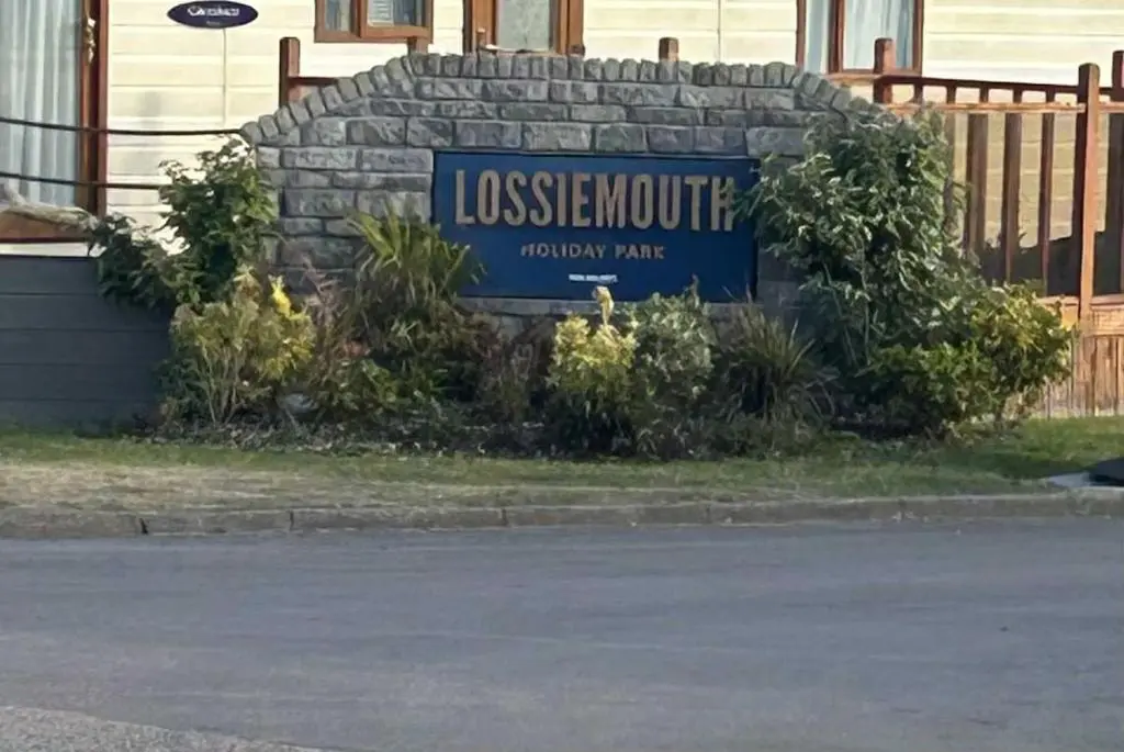 a sign for a house in front of a building at Clearwater Lodge in Lossiemouth