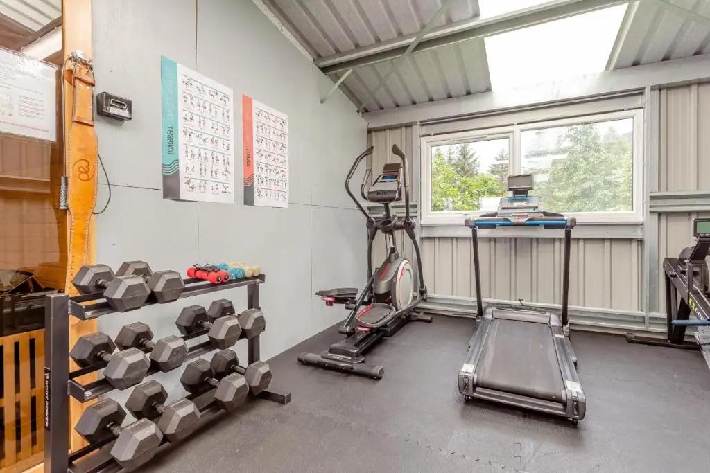 a gym with a bunch of dumbbells in a room at 2 Bed in Newtonmore oc-d32413 in Newtonmore