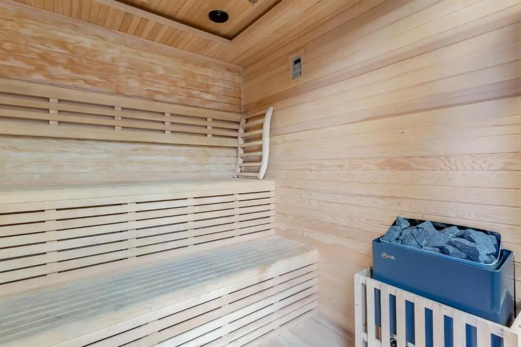 a sauna with wooden paneling and a blue box at 2 Bed in Newtonmore oc-d32413 in Newtonmore