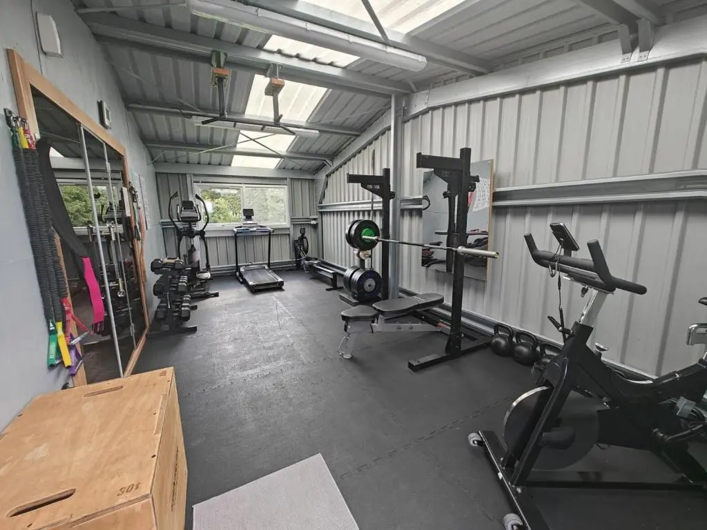 a gym with several treadmills and machines in it at 2 Bed in Newtonmore oc-e32418 in Newtonmore