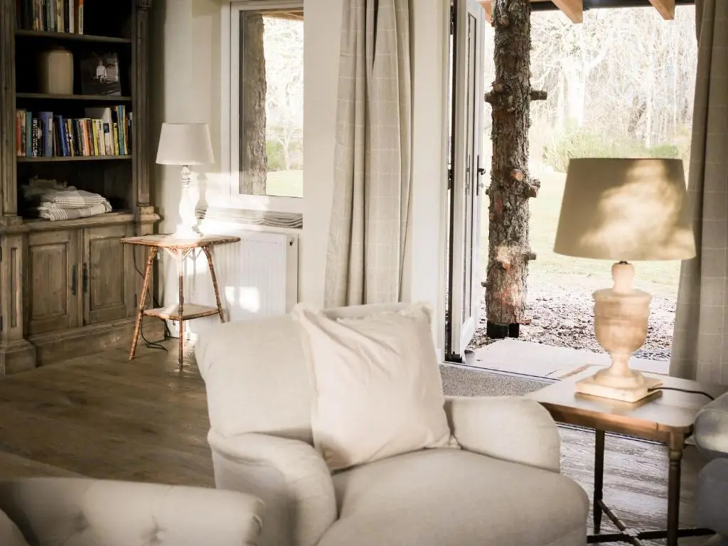 a living room with a white couch and a window at Relugas Mill in Forres