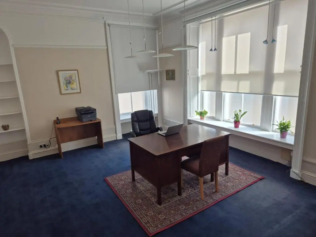 an office room with a table and chairs and a desk at Bank House in Inverness