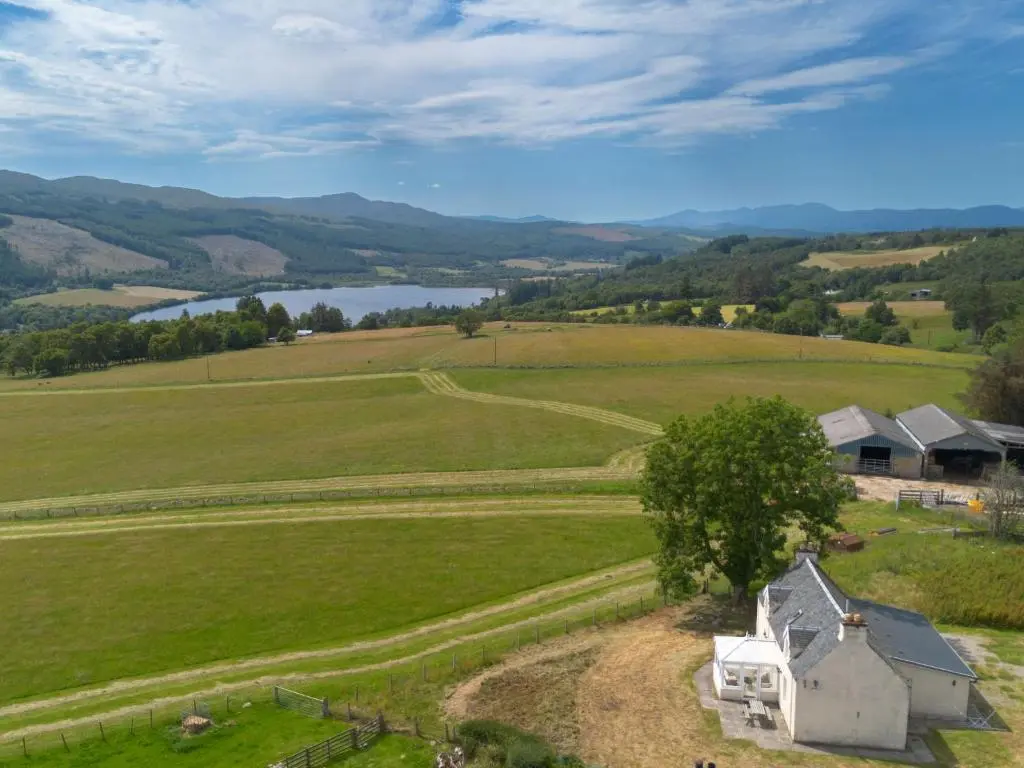 an aerial view of a farm with a house in a field at Holiday Home The Manor House by Interhome in Balnain
