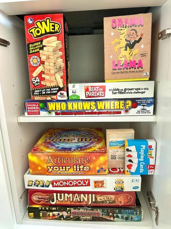 a refrigerator filled with lots of snacks and books at V\u016b by the Bridge, Inverness City Centre in Inverness
