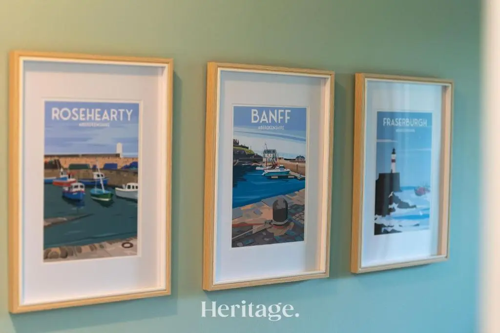 three framed pictures hanging on a wall at Woodside, Get away with Hot Tub, near Fraserburgh in Strichen