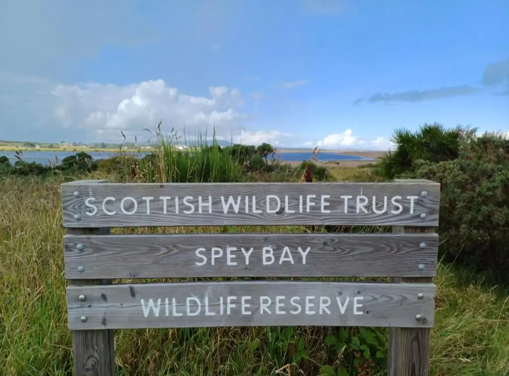 a sign that reads scottish wildlife trust andbeybeybeybeybeybey at Mary Cottage in Garmouth