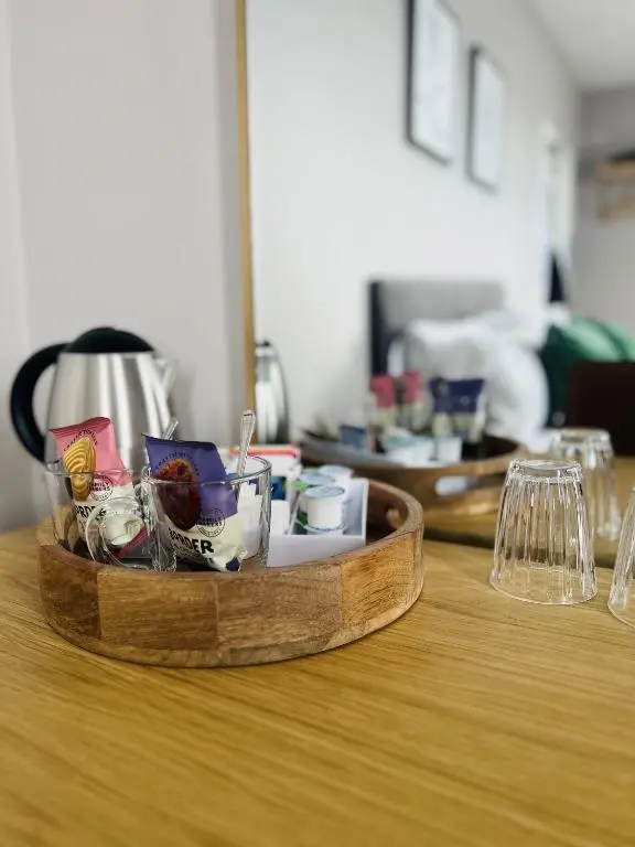 a wooden tray filled with items on top of a table at Tuckers Inn in Invergordon