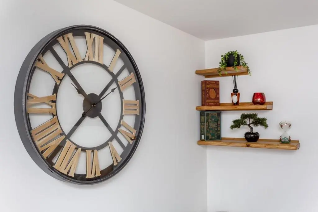 a clock on a wall with two shelves at 2 Bed in Inverness oc-b32706 in Inverness