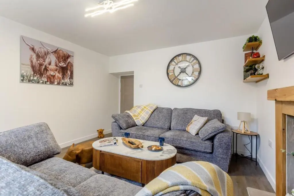 a living room with a couch and a table at 2 Bed in Inverness oc-b32706 in Inverness