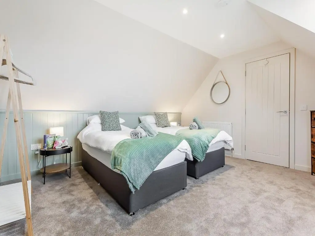 a bedroom with two beds in a attic at Sea Breezes in Balintore