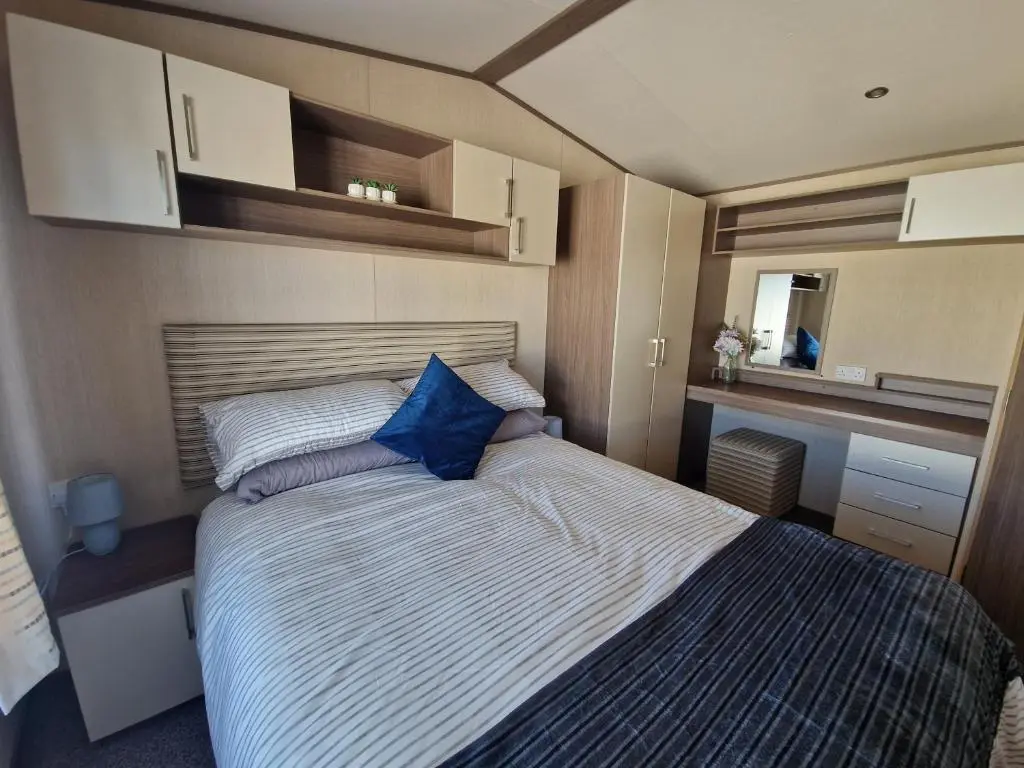 a bedroom with a bed in a small room at Cladach in Lossiemouth