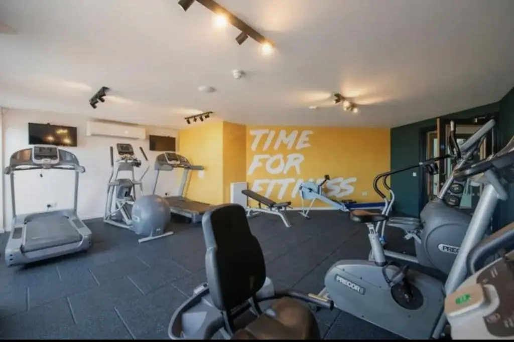 a gym with several exercise bikes in a room at Cladach in Lossiemouth