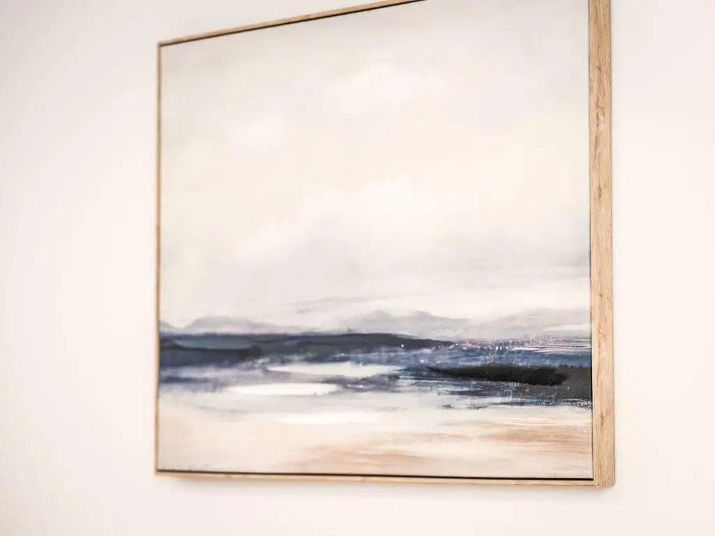 a painting of a beach in a frame on a wall at Apartment Fishertown Apartment 1st Floor by Interhome in Nairn