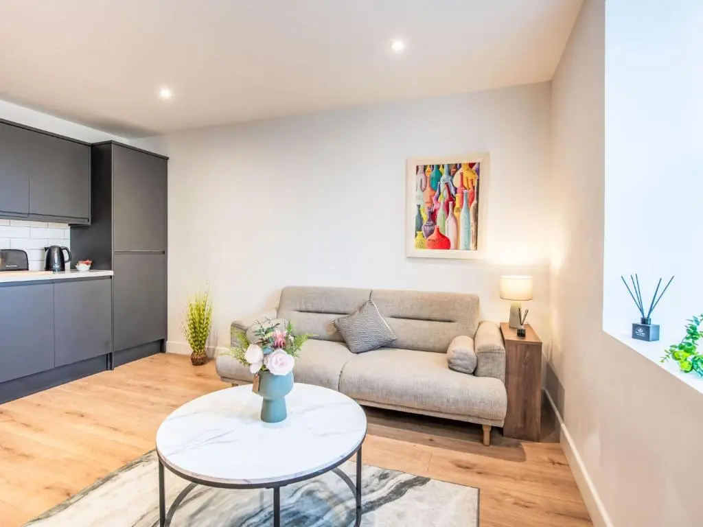 a living room with a couch and a table at Apartment Fishertown Apartment 1st Floor by Interhome in Nairn