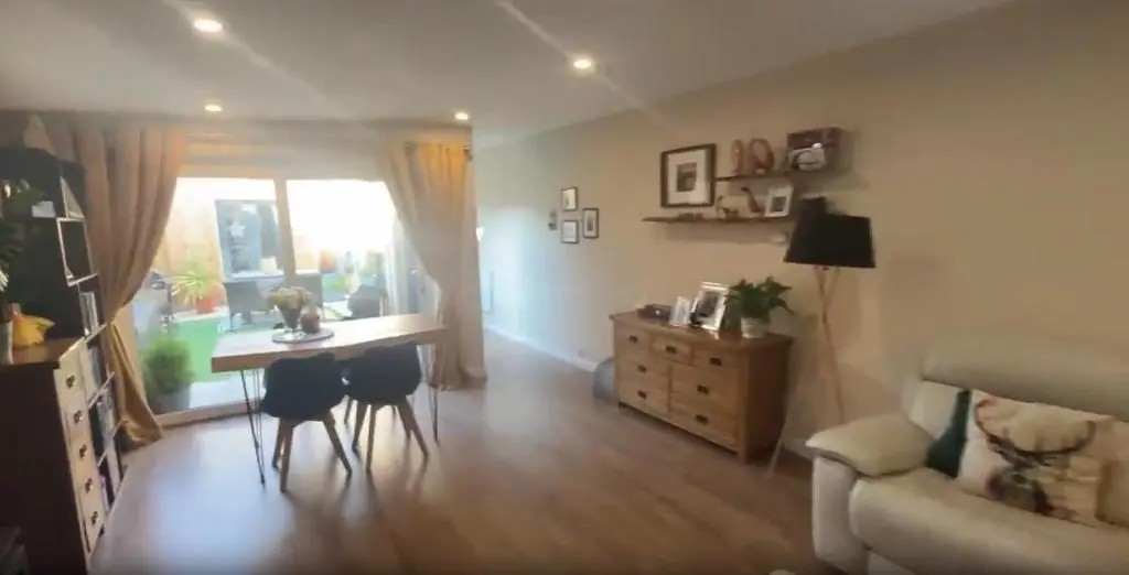 a living room with a table and chairs and a couch at White Crystal in Invergordon