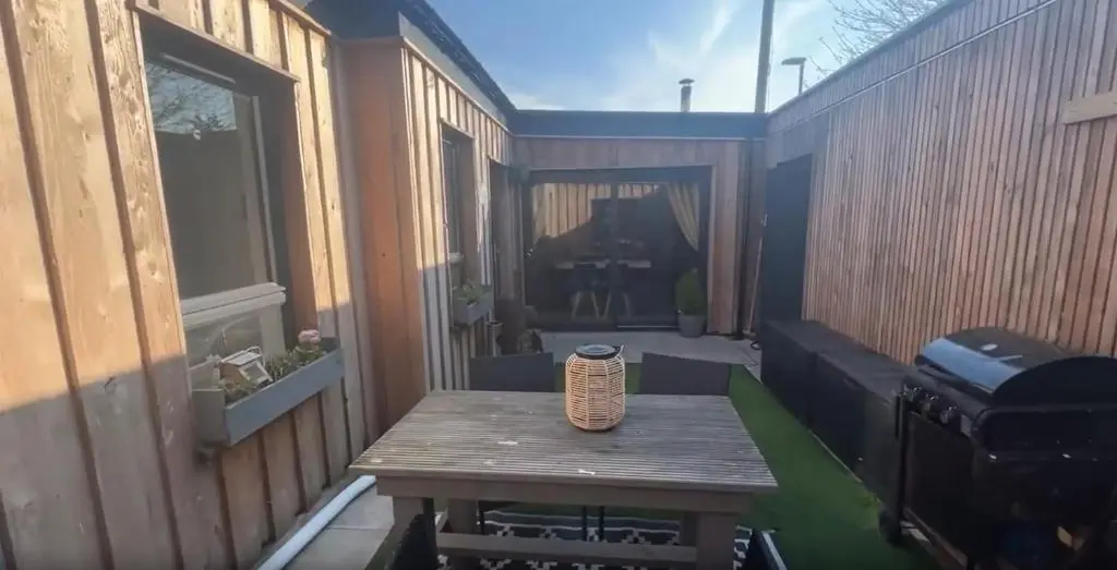 a small patio with a table and a grill at White Crystal in Invergordon