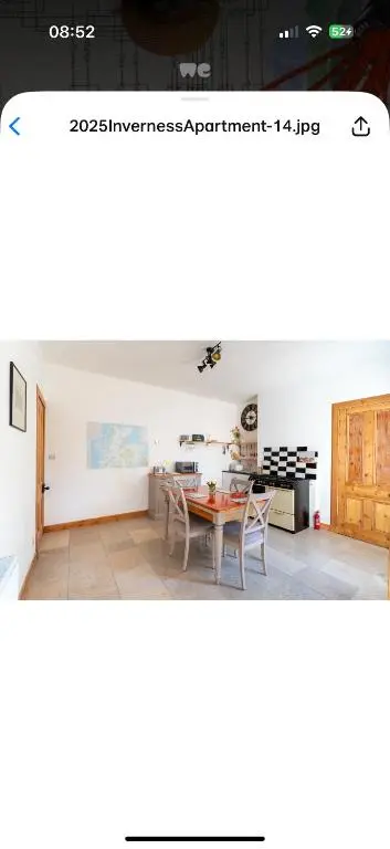 a kitchen and a dining room with a table at Hawthorn villa in Dalneigh