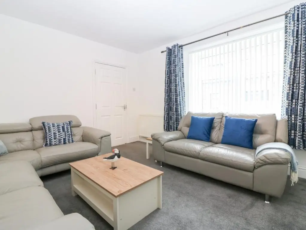 a living room with two couches and a coffee table at No 9 North St in Fraserburgh