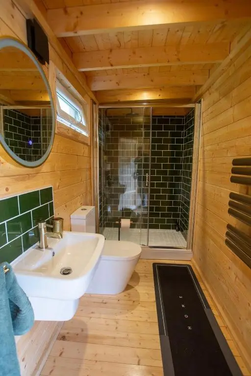 a bathroom with a tub and a sink and a shower at Fishers Rest in Lybster