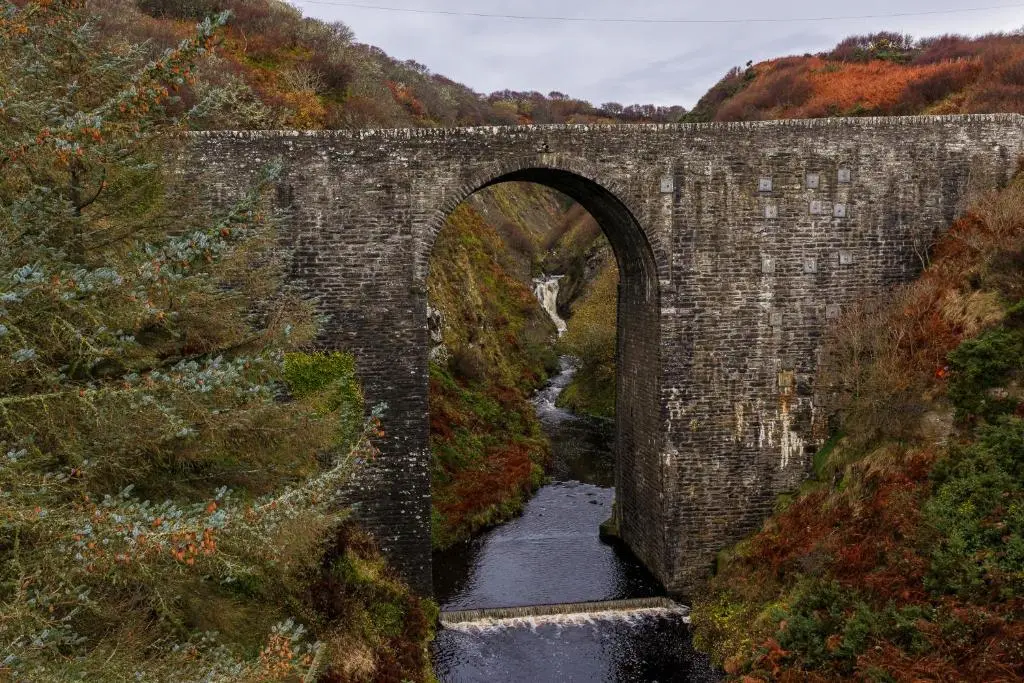 an old brick bridge with a river under it at Fishers Rest in Lybster