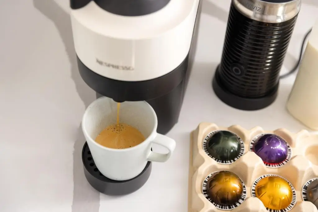 a coffee maker pouring coffee into a cup on a counter at Muckle View in Gardenstown