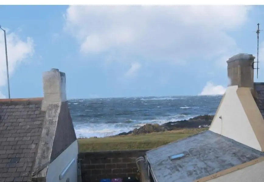 a view of the ocean from the roof of a house at Wee Braemoray, Portessie, Buckie,Moray in Portessie