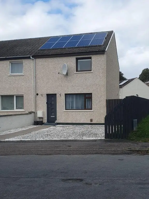 a house with a lot of solar panels on it at Highland Breeze Inverness in Inverness