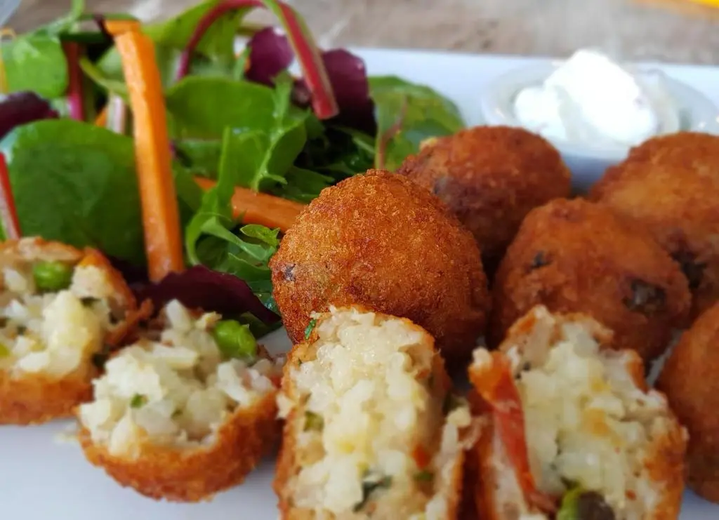 a plate of food with a salad and some food balls at The Havelock in Nairn