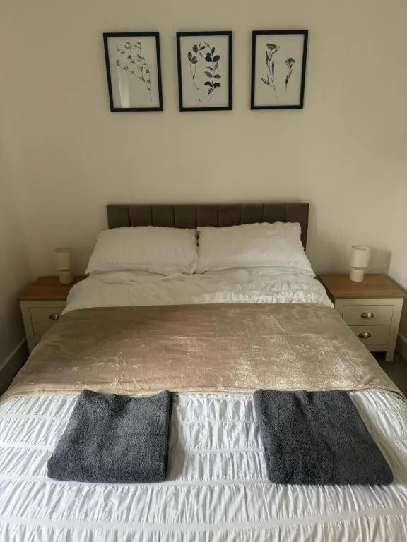 a bed with two pillows on it in a bedroom at Stephen's Brae Apartment, Inverness City Centre in Inverness